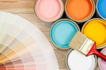 A painter is choosing a paint shade for the interior of the house's walls. with interior