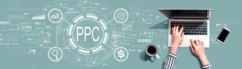 Obraz na płótnie Canvas PPC - Pay per click concept with person using a laptop computer