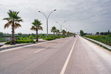 asphalt road with a white dividing strip. The concept of car tourism.