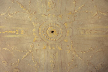 beautiful painting on the walls and ceiling of an old european castle in italy