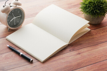 high angle view of open notepad on black background 