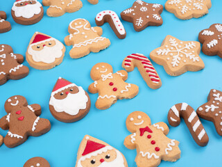 Christmas homemade gingerbread cookies on the cyan background