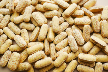 Close up of many vitamin pills on white background 