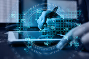 Businessman using tablet computer with envelope icon