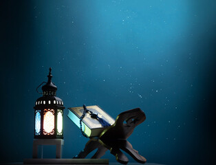 Kuran or Quran , the holy book of all Muslim shined by brighten lantern - obrazy, fototapety, plakaty