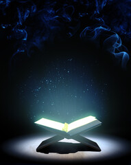 Quran or Kuran, the islamic holy book, in dark background - 496645734