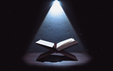 Quran or Kuran, the islamic holy book, in dark background - 496645736