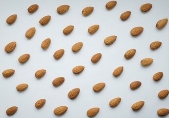 background texture of almond nuts on a white background.
