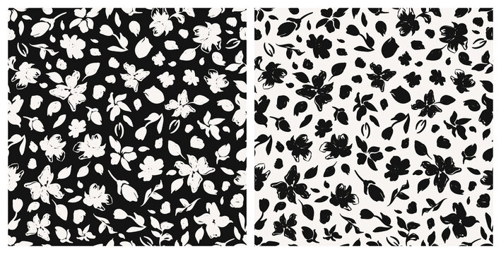 Set of monochrome floral seamless repeat pattern. Random placed, black and white vector botanical plant silhouettes all over print.