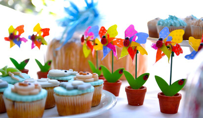 birthday cupcakes on a well decorated table