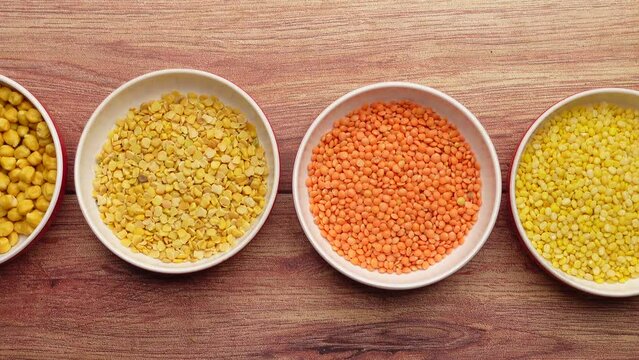 Bowl of uncooked dhal on table top view 