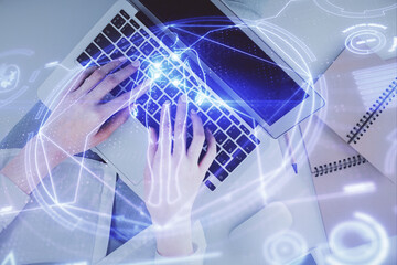 Double exposure of woman hands working on computer and education theme hologram drawing. Top View. Science concept.