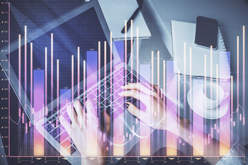 Double exposure of woman hands typing on computer and forex chart hologram drawing. Stock market invest concept.