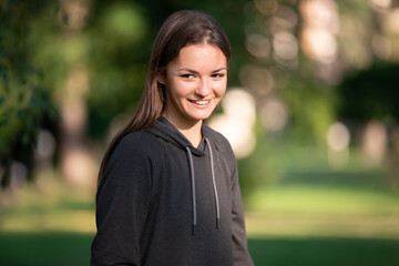 Portrait of young smiling beautiful women outdoors on summer sunny day