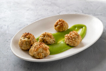 Fish meatballs with broccoli puree. Proper nutrition concept. Diet dish. Vegetarian food.