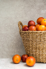 basket full of blood oranges on the table.