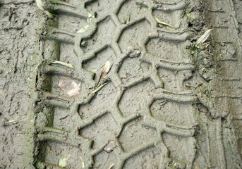 Tyre track on dirt sand or mud.