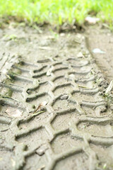 Tyre track on dirt sand or mud.