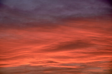 Sky light after sunset. orange background, clouds