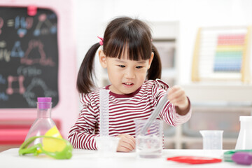 young girl playing Science experiment toys for homeschooling