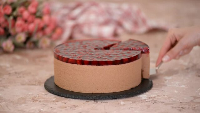Delicious chocolate mousse cake with cherries jelly.
