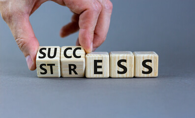 Success instead of stress symbol. Businessman turns cubes and changes the concept word Stress to Success. Beautiful grey background. Business psychological success or stress concept. Copy space.