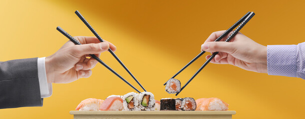 Man and woman eating sushi together