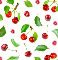 Background from flying cherries and green leaves.