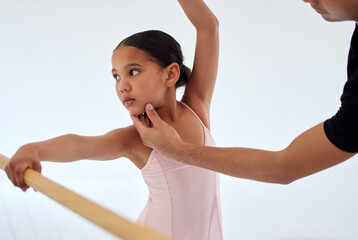 Look this way. Closeup shot of a ballet teacher assisting a student with her position in a dance studio.