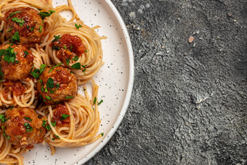 Close-up of Italian pasta with tomato sauce and meatballs. Restaurant menu, dieting, cookbook...