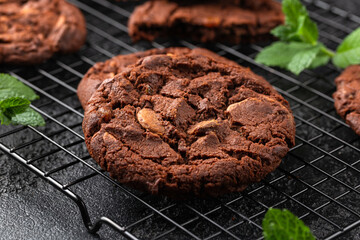Chocolate, orange chip cookies on cooling rack