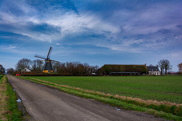 Beautiful view of an old dutch windmill and a perspective