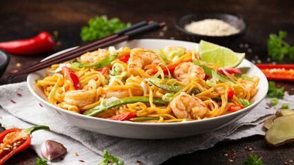 Stir fry noodles with prawns and vegetables in white plate. Healthy asian food