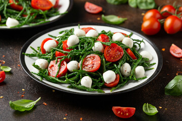 Fresh Samphire salad with cherry tomatoes and mozzarella. Healthy food.