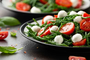  Fresh Samphire salad with cherry tomatoes and mozzarella. Healthy food. © grinchh