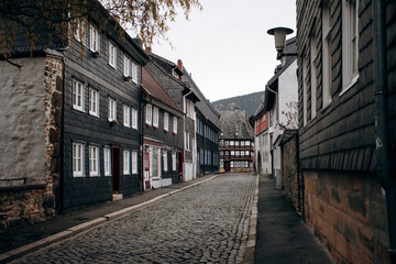 Fototapeta na wymiar View on timbered houses and cobbled street in the historic old town of Goslar, Germany