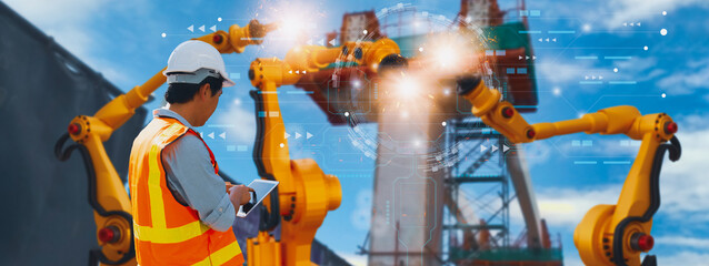 Industry engineer construction,using smart tablet,control automation robot arm machine intelligence operation construction site,concept business industry 4.0,Artificial intelligence or AI,5G network