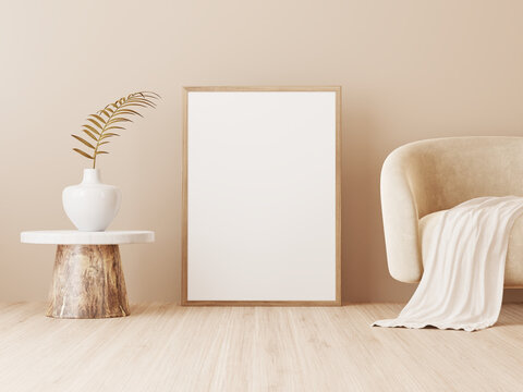 Poster art mockup with large vertical wooden frame standing on floor in minimalist living room interior with beige sofa, palm leaf decoration and warm neutral background. Illustration, 3d rendering