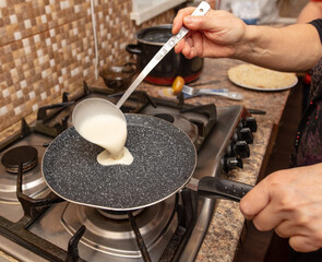 Pancakes from liquid dough are fried
