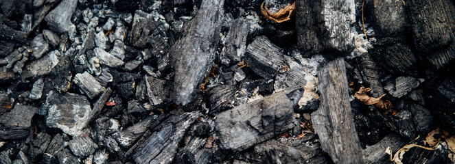 The texture of dark gray charcoal . Coal in large chunks, energy reserve. Natural background.