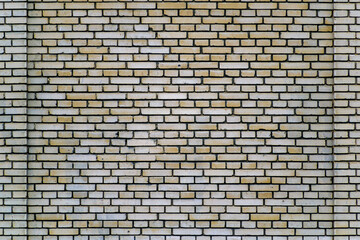 white brick area with protruding corners on the sides