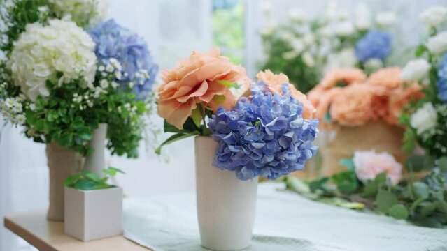 floral flower bouquet business shop,beaufiful fresh flower hydrangea white rose and natural basket arrange with order on table in flower small business shop 