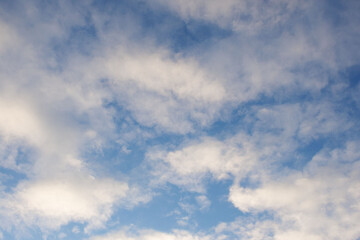 White fluffy clouds in the blue sky.