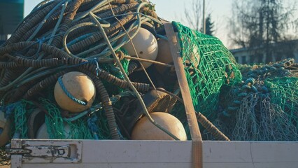 Pile of Tangled Up Professional Nylon Fishing Net with Buoys and Markers