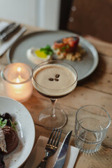 Still life shot of coffee cocktail and delicious desserts on a table in a cafe.