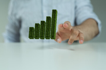 green growing on top in nature green background. Money saving, investment