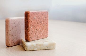 selection of stone samples for countertops and floors. Pieces of artificial acrylic stone in a sample box. A set of shades of countertops of different textures. Place for text, copyspace.