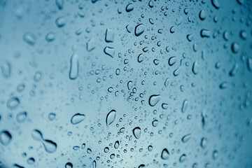 rain drop wet moise on the glass blue cool fresh chill nature background