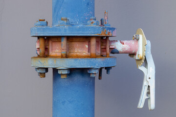closeup water pipes of industry building watering system at roof top outdoor pipe valve with handle lock.