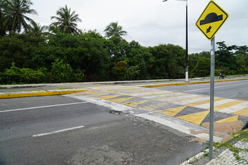 Speed bump on asphalt road, speed bump on street. Brazilian name quebra mola or lombada. State of...
